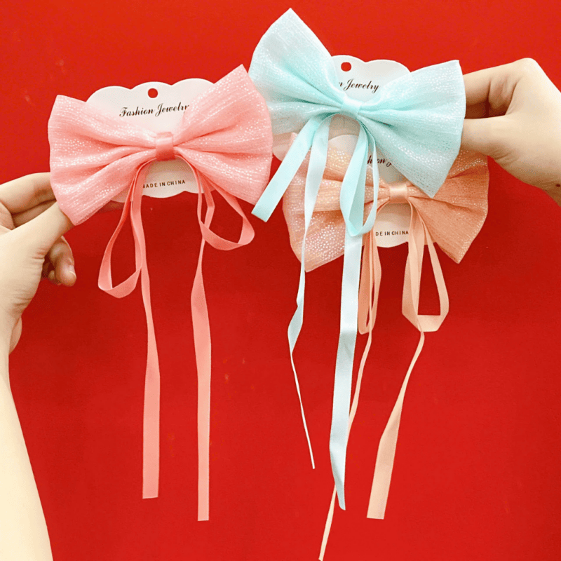 Kẹp vịt nơ sequin Streamer